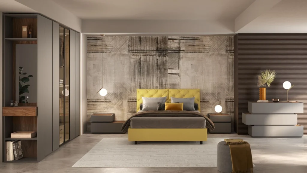 Camera da letto Joanna di BEHOME con letto giallo, ampio armadio grigio con vetrina e comò dal design moderno.
